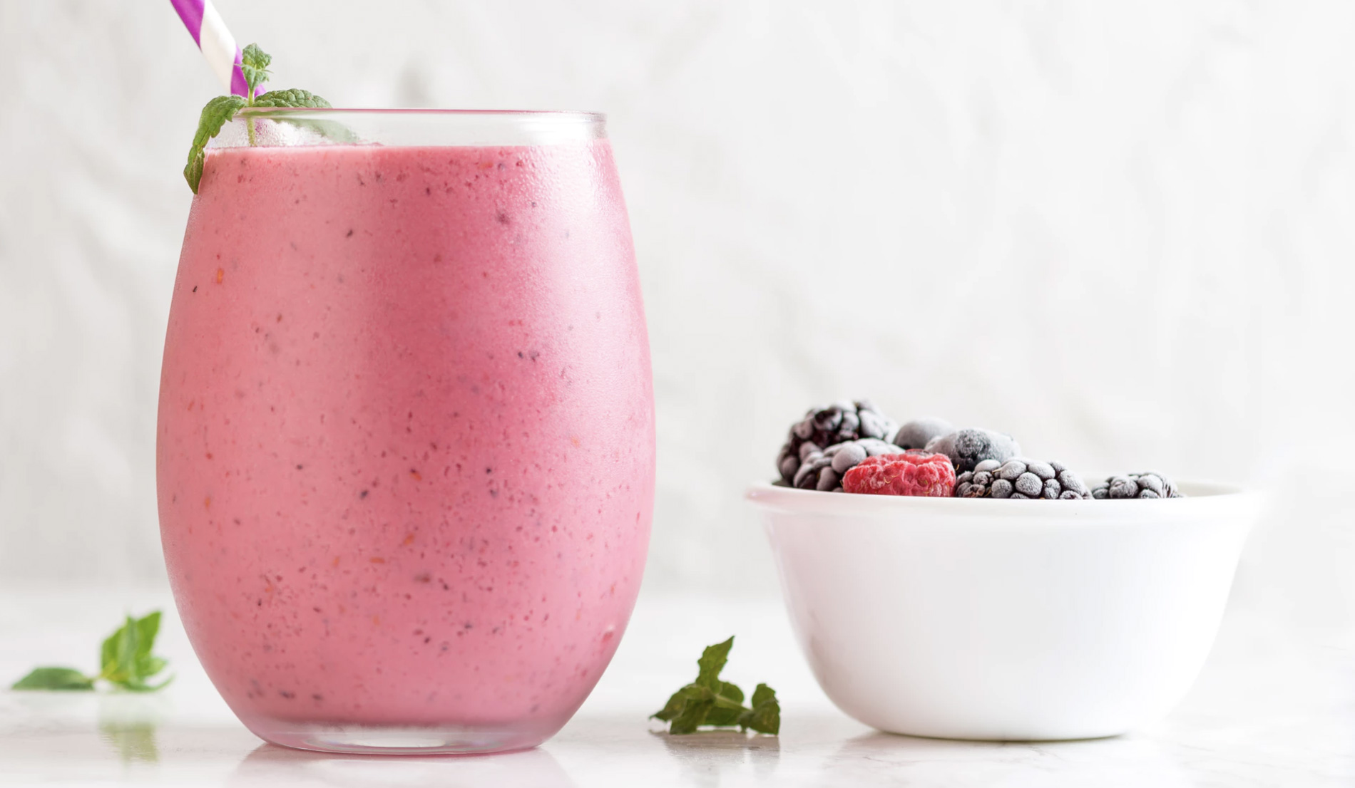 Smoothie and fruits on a table