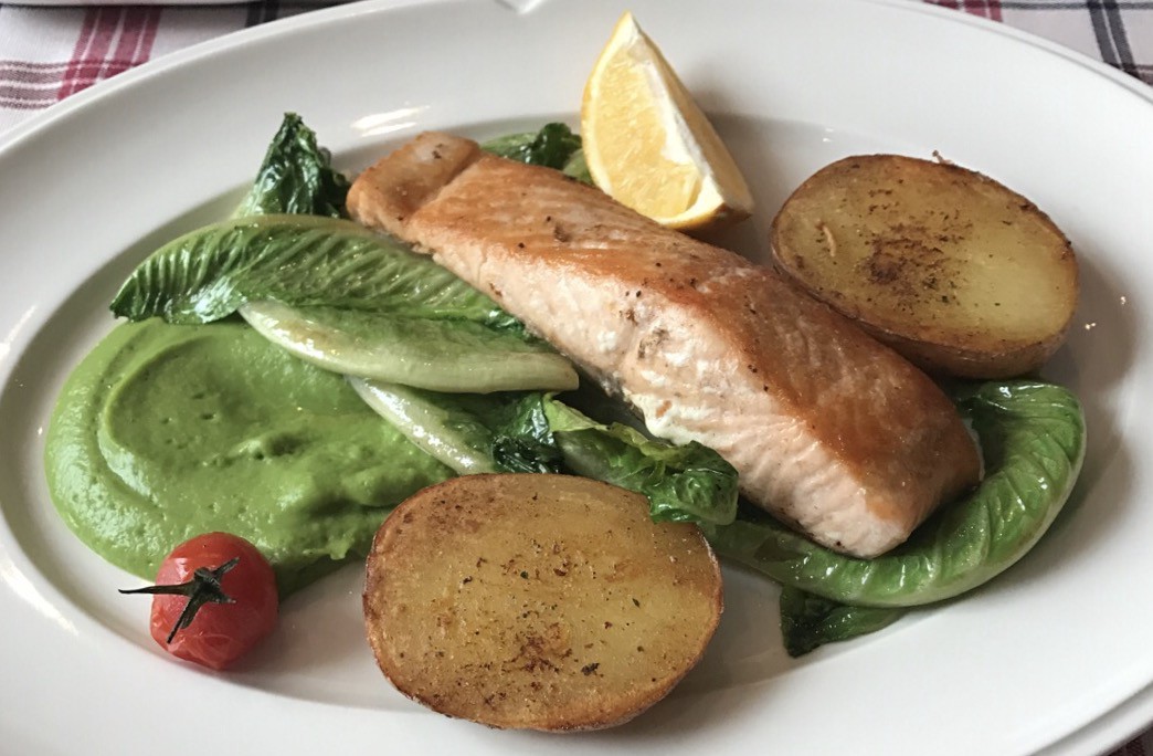 Fish, potato and salad on a plate