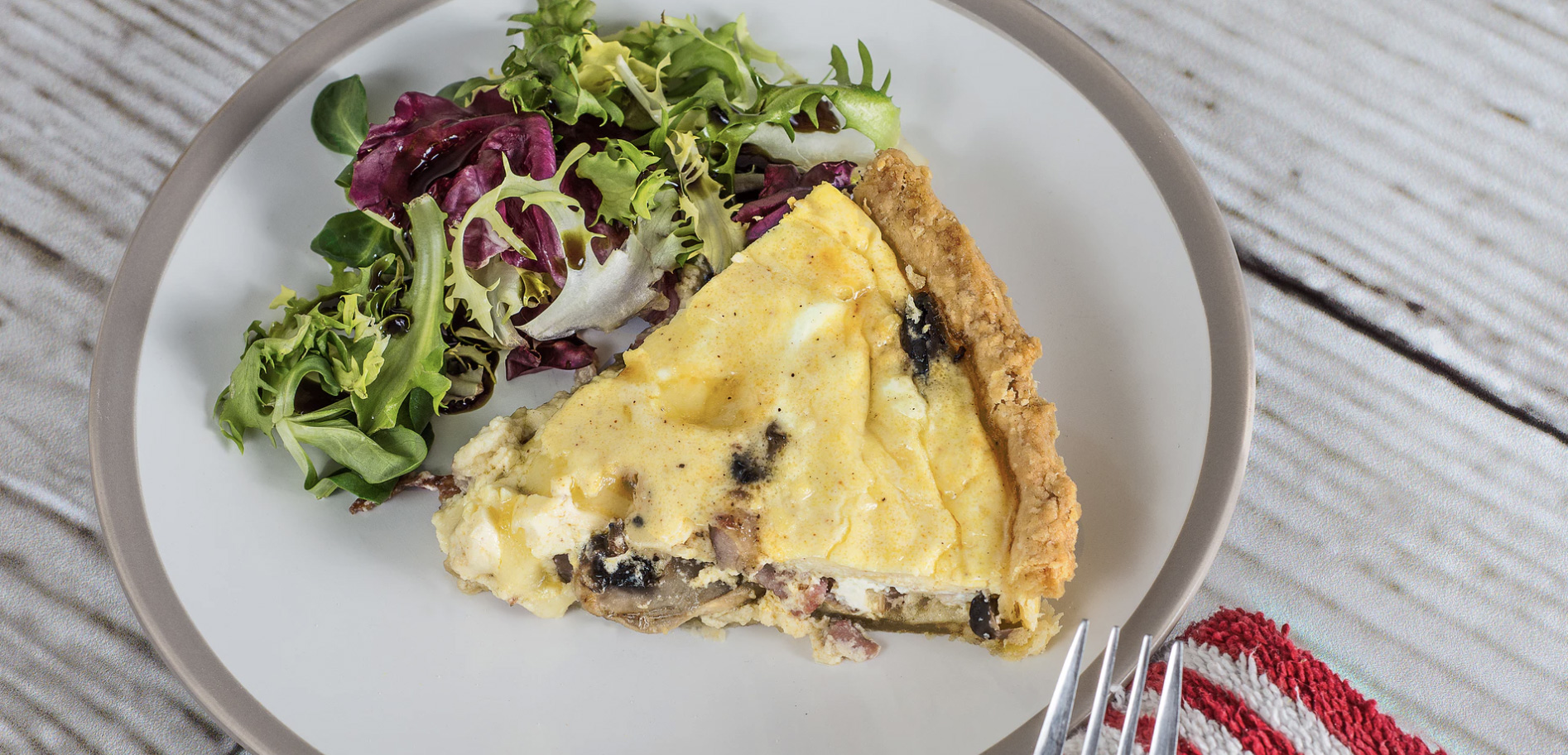 Salad and spanish tortilla on a plate