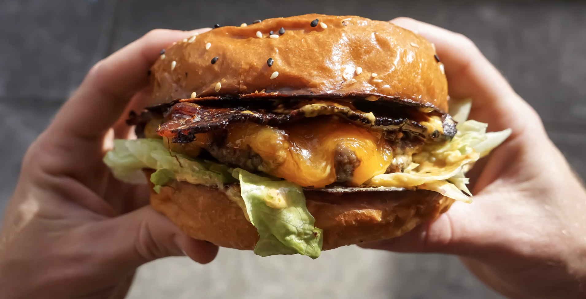 Good looking hamburger in hands