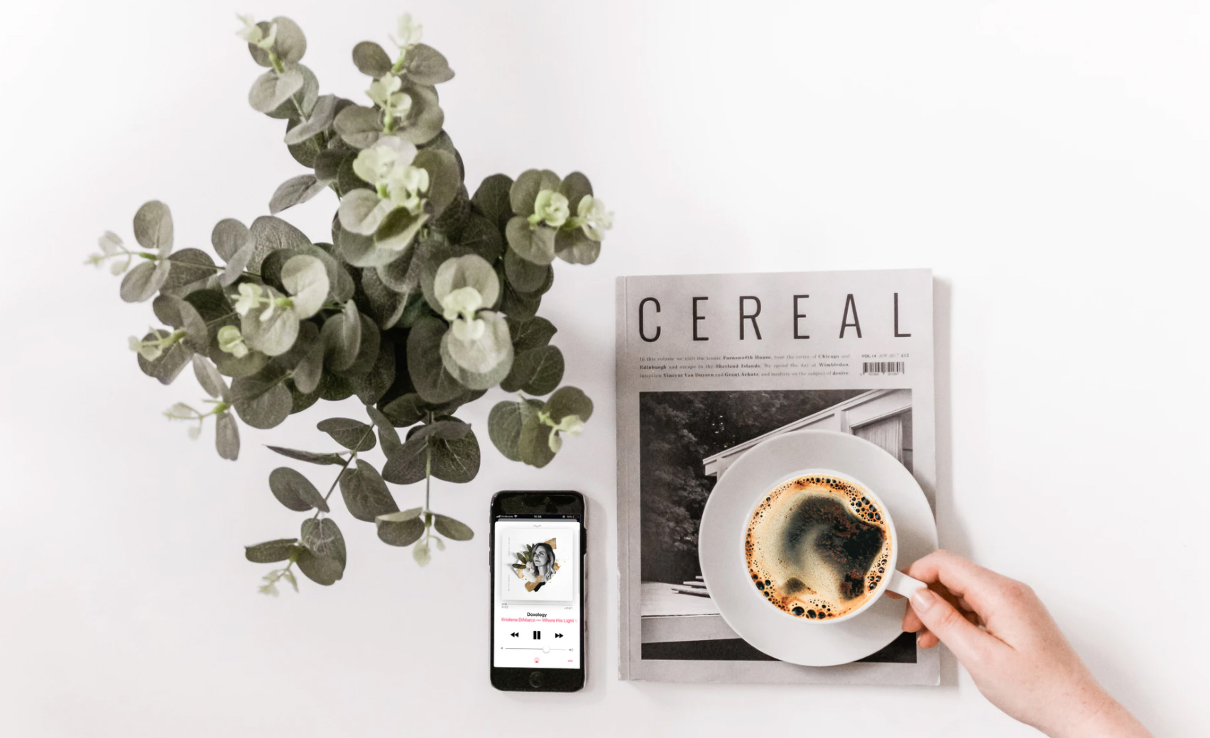 Person drinking coffee and listening to music. Unsplash - Sincerely Media