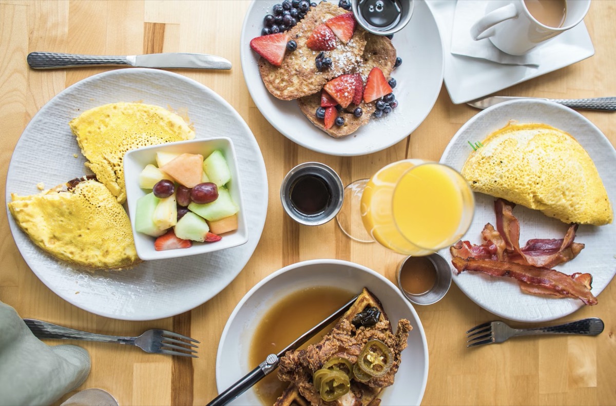 Group of friends eating breakfast meals together. Image: Unsplash - Heather Ford