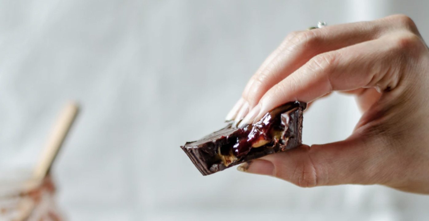 Chocolate being held in woman's hand 