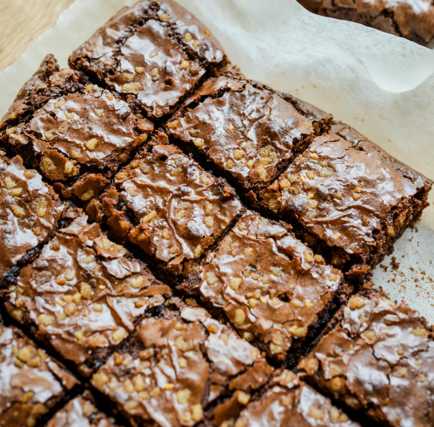 A tray of brownies cut up 