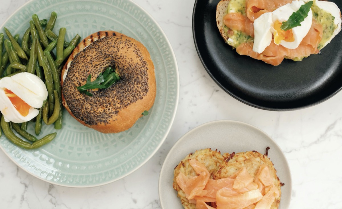 Plates of food with eggs and lox. 