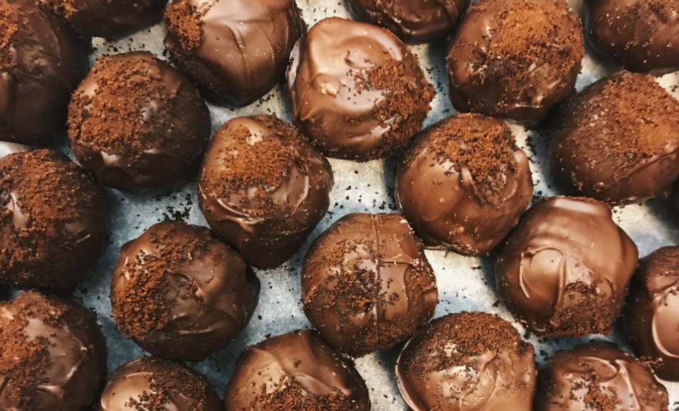 A table with chocolate truffles. 