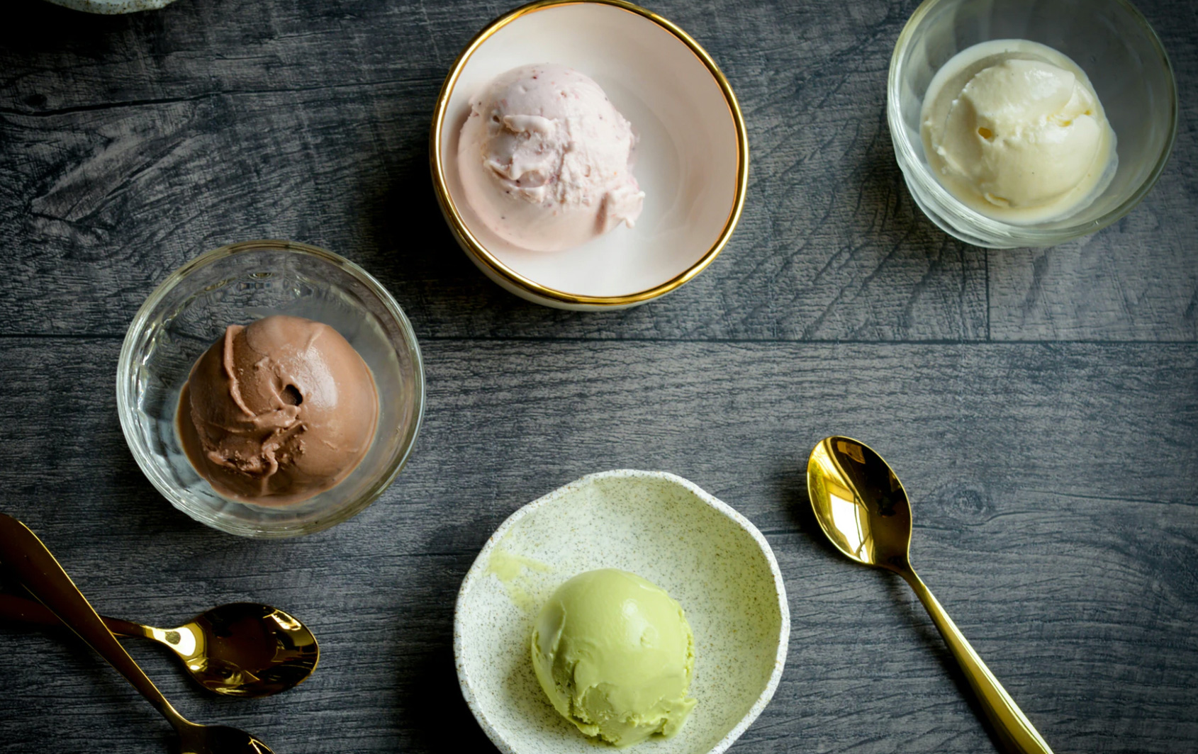 Bowls of different ice creams out on a table