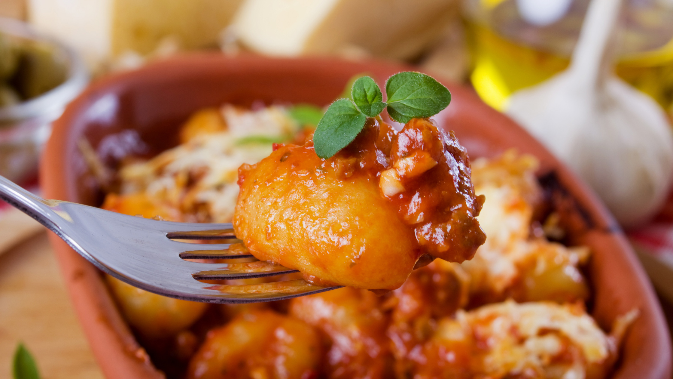 Gnocchi with tomato sauce at restaurant. Image - Canva 