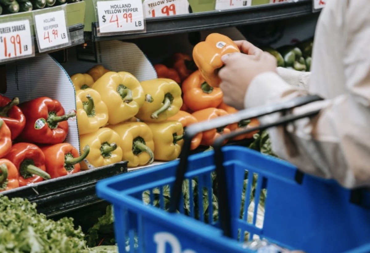 Buying vegetables at supermarket