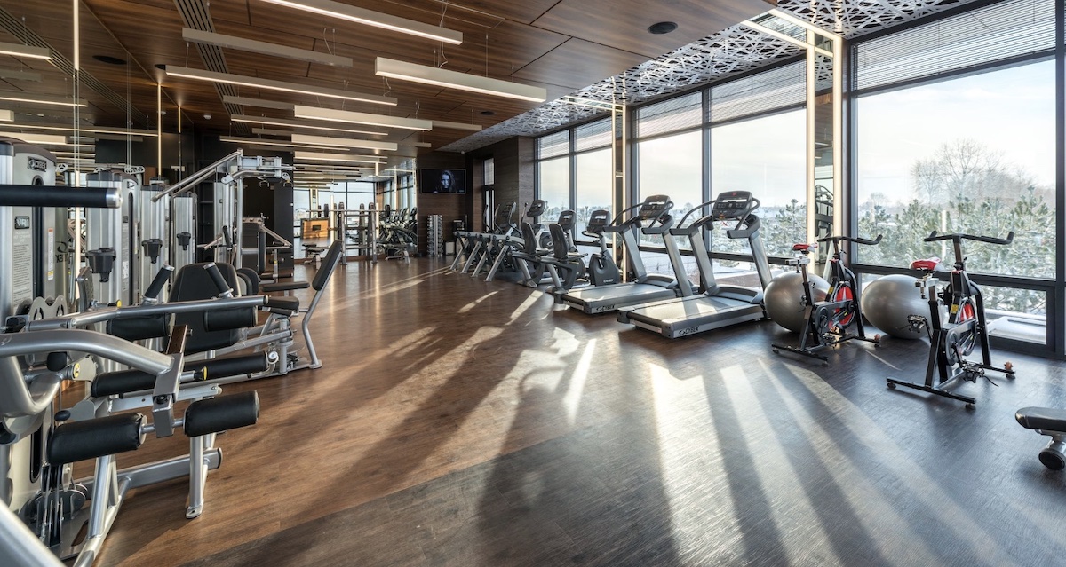 An empty gym with cardio and weight machines