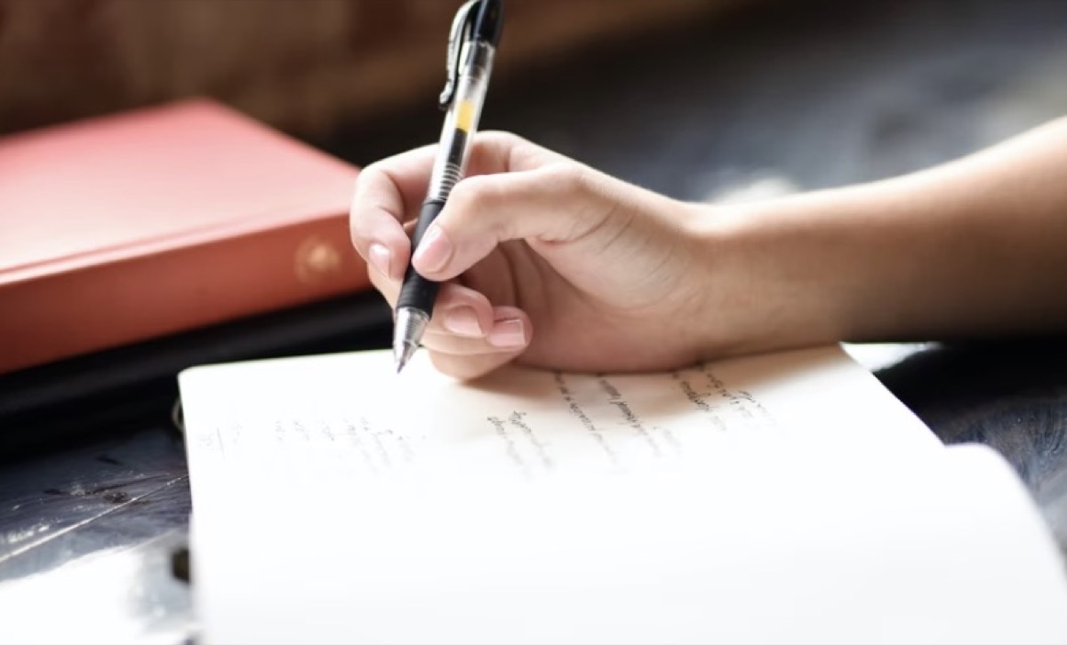 Woman journaling in a notebook