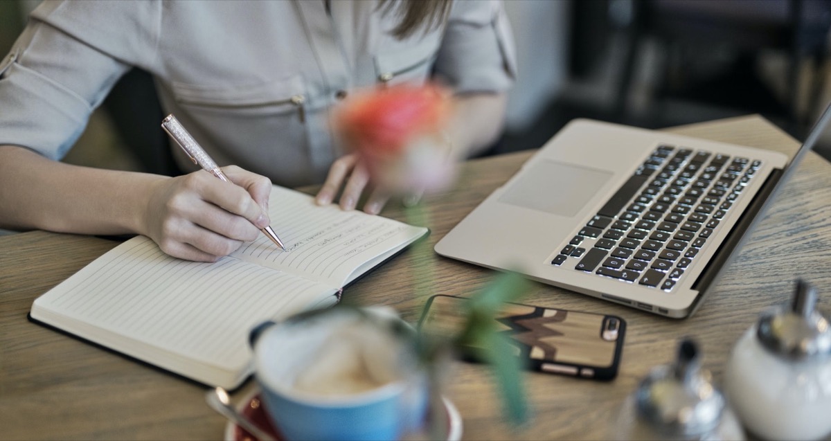 Woman journaling and writing. 