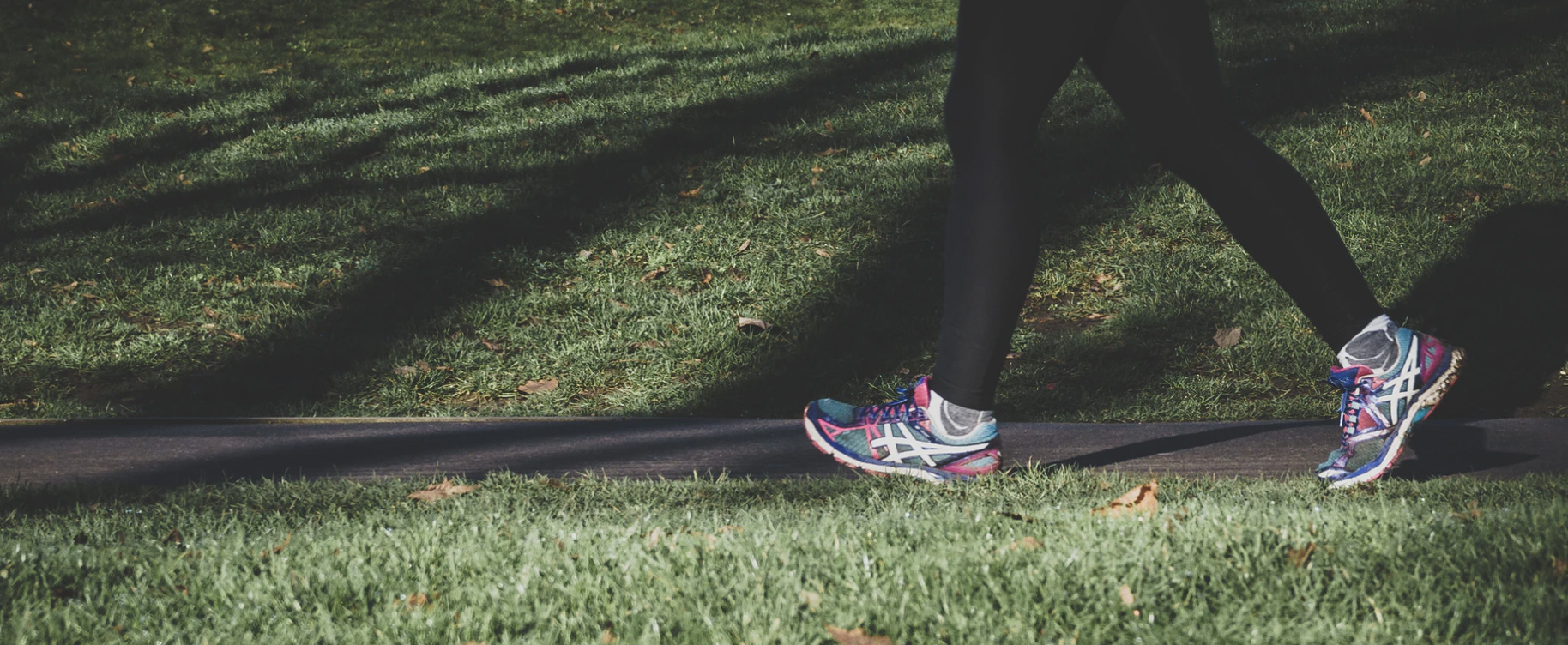 A woman walking outside in her sneakers