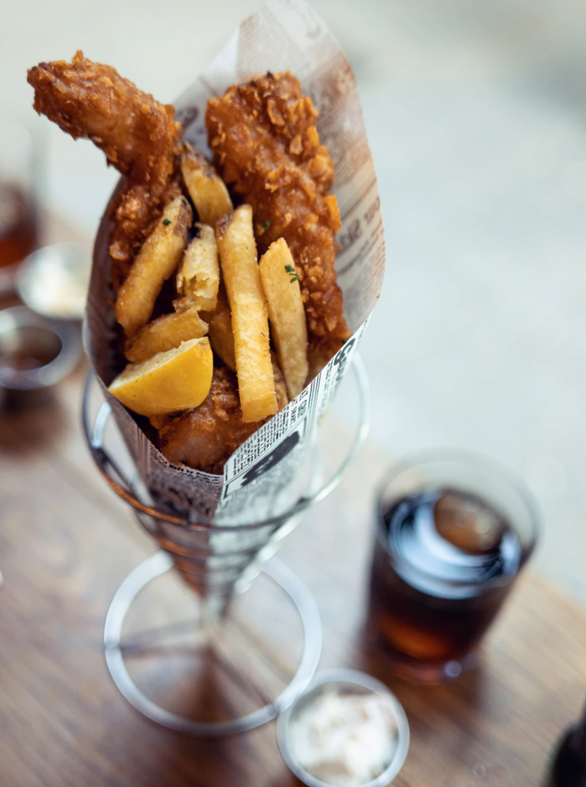 French fries and fried chicken in a cup 