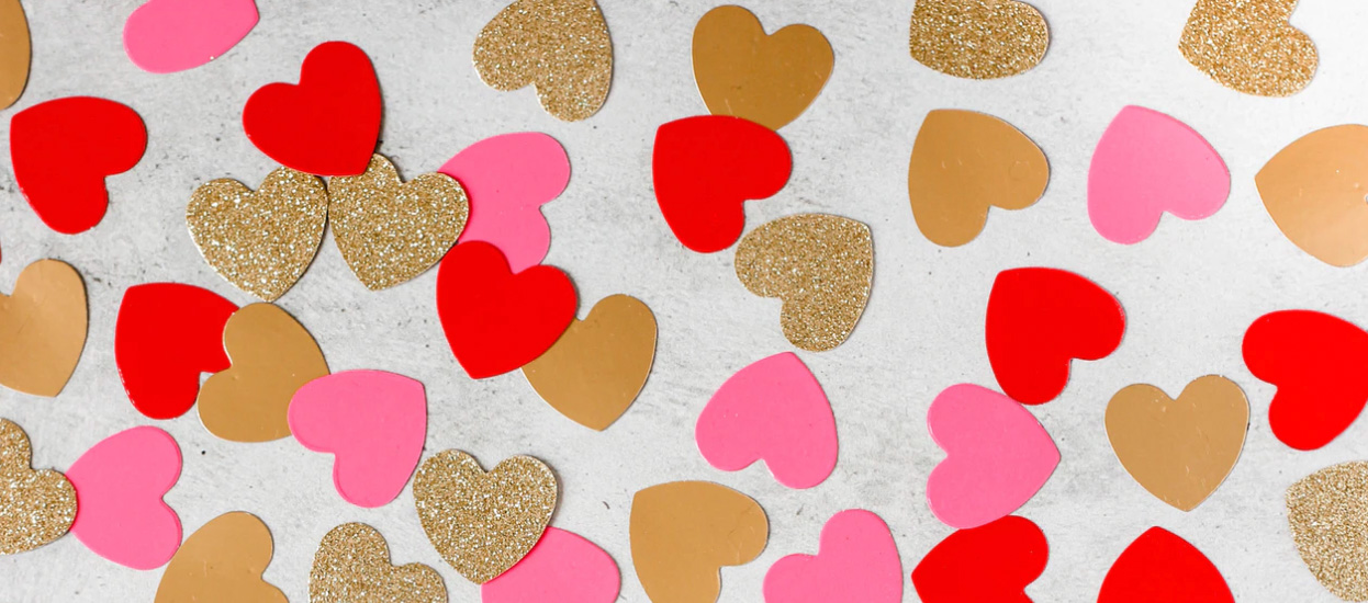 Paper hearts laid out on a table 