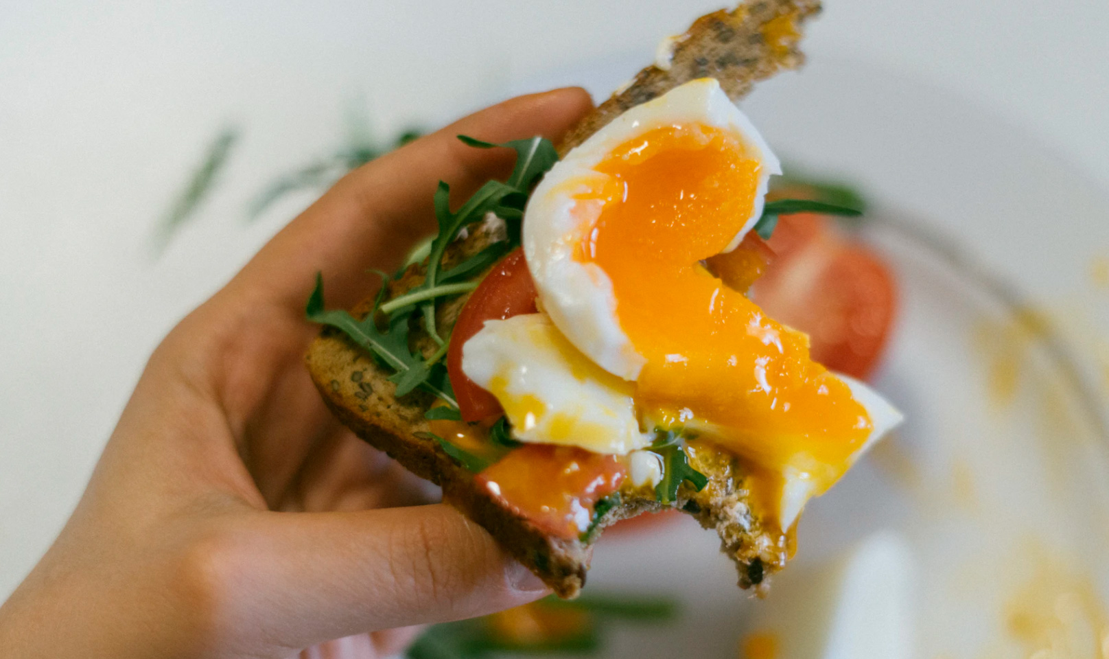 Breakfast toast with eggs, and vegetables.