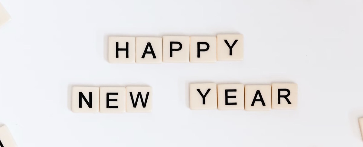 Tiles writing out Happy New Year. Unsplash - Sincerely Media