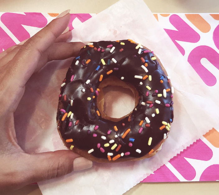 Girl with donut in her hands 