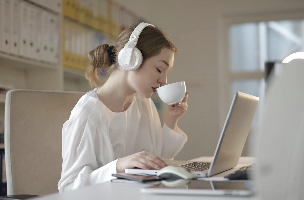 Listening to music and drinking coffee while working. Image: Pexels - Andrea Piacquadio