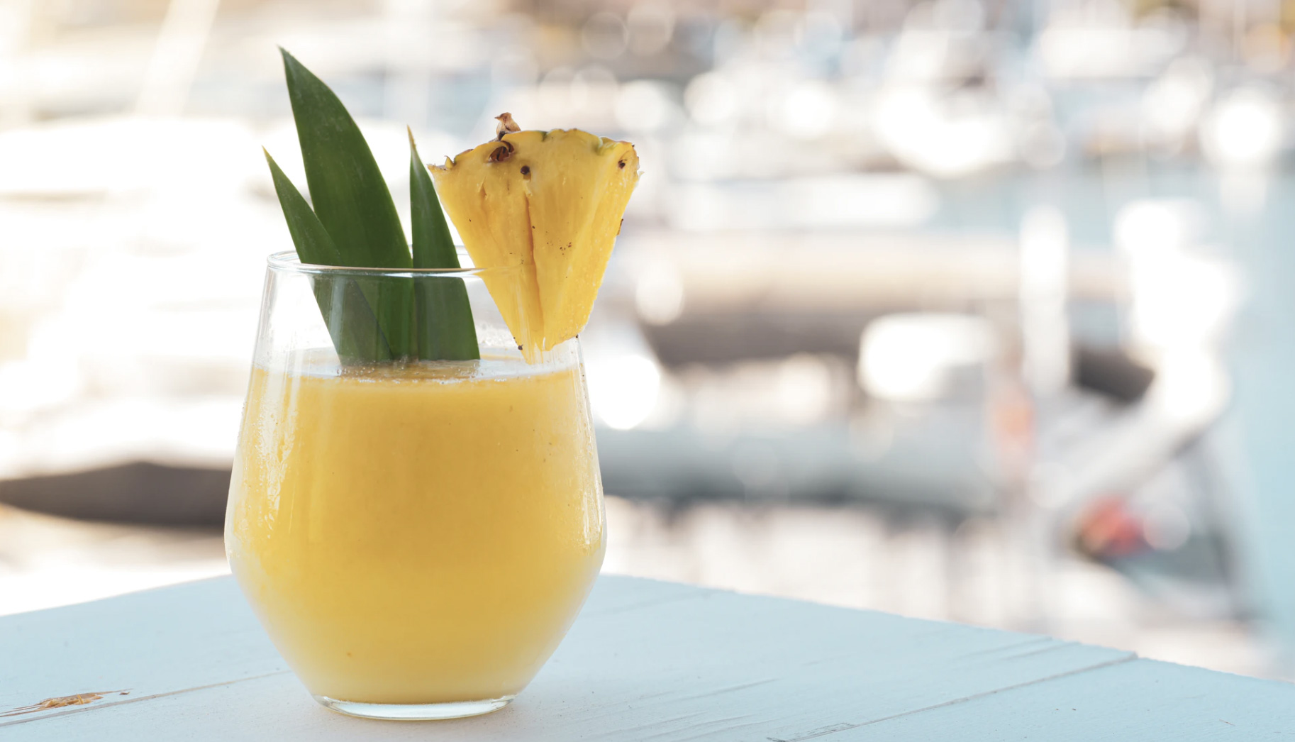 Pina colada near the water. Unsplash - YesMore Content