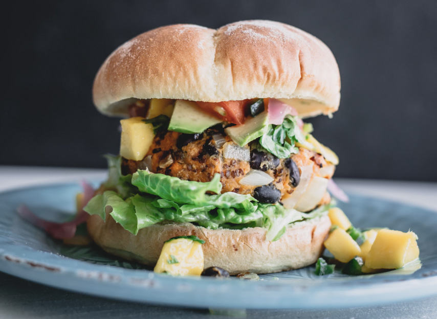 Plant based burger with lettuce and all in a bun.