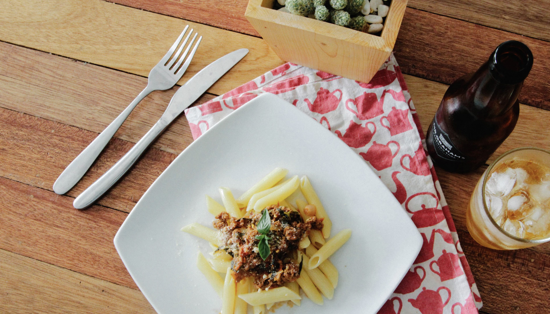 Pasta on a white plate being served 