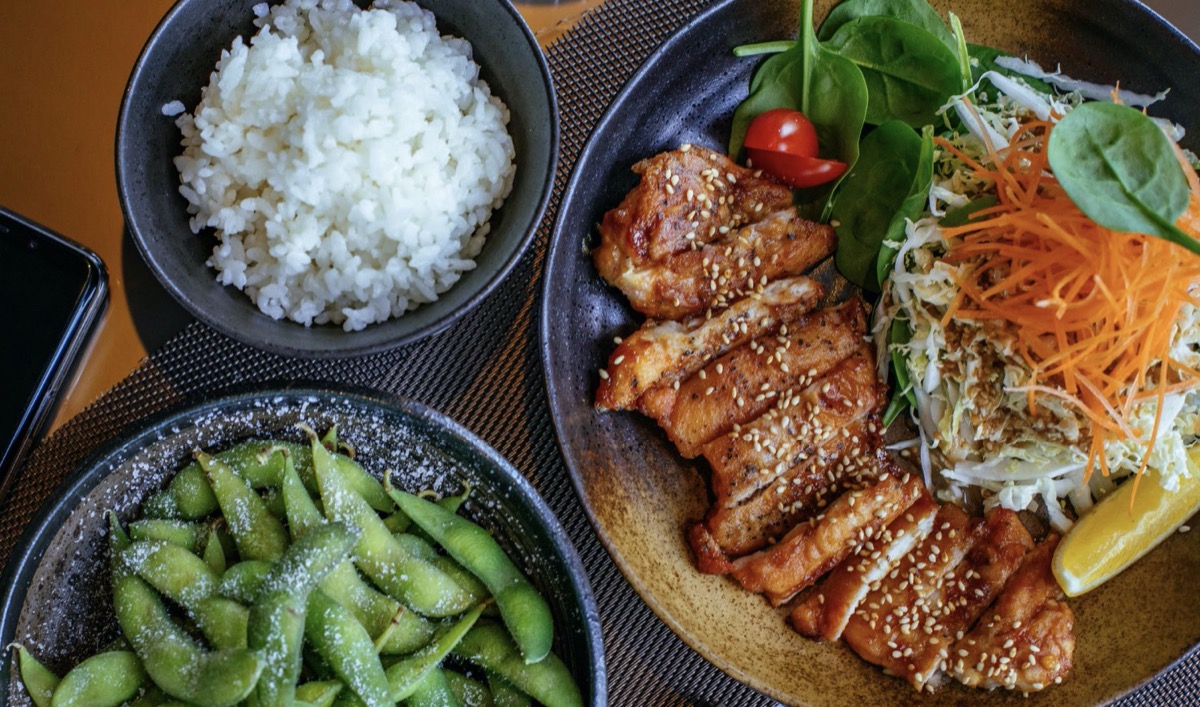 Plate of chicken and salad, and rice