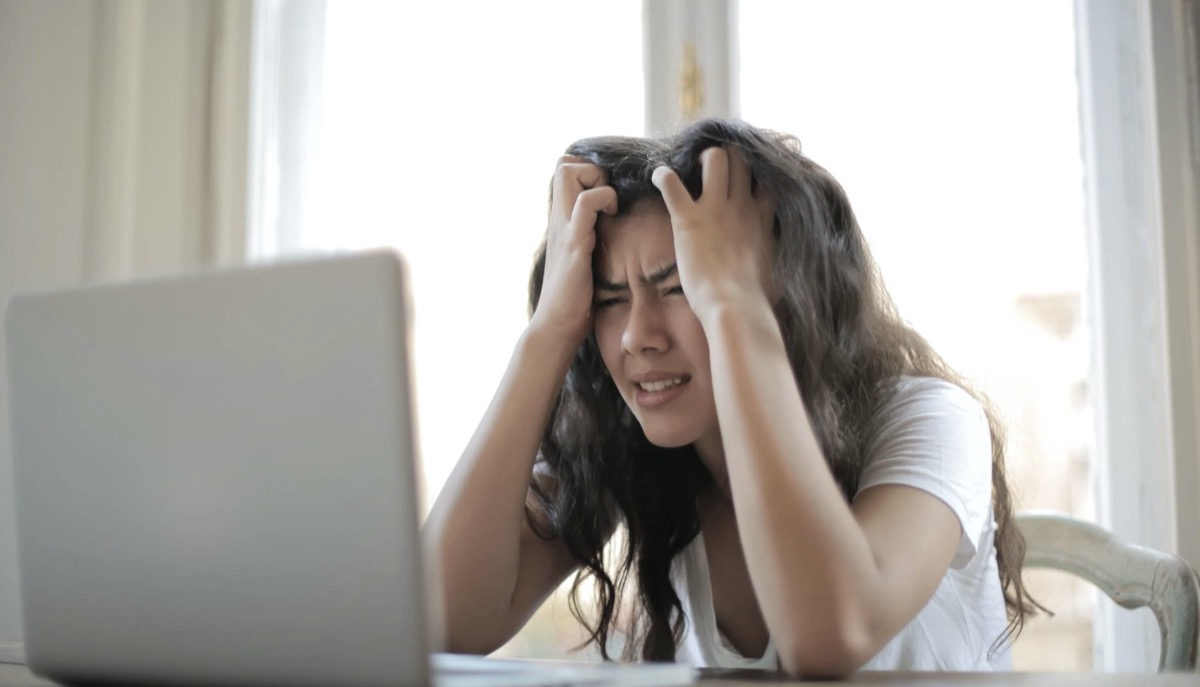 Woman frustrated looking at computer 