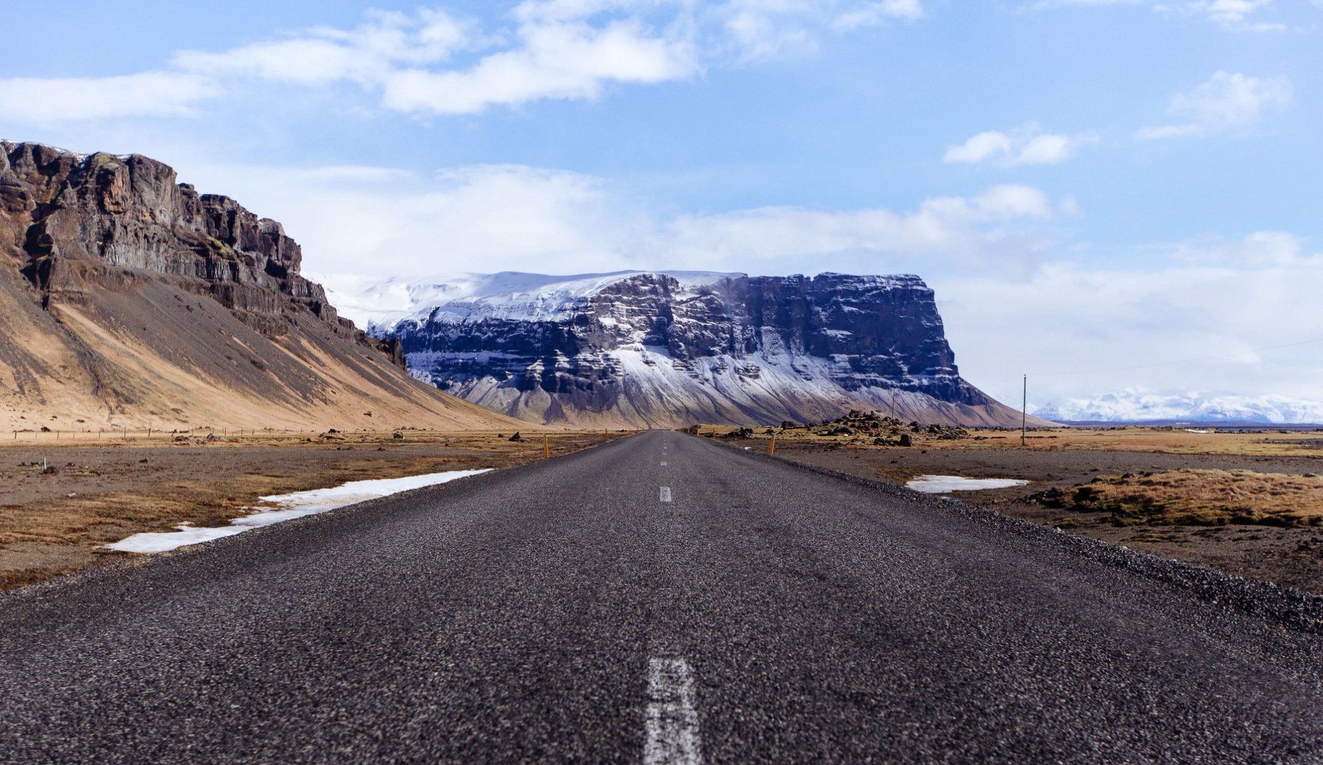 Road trip with mountains. Unsplash - Anders Jilden 