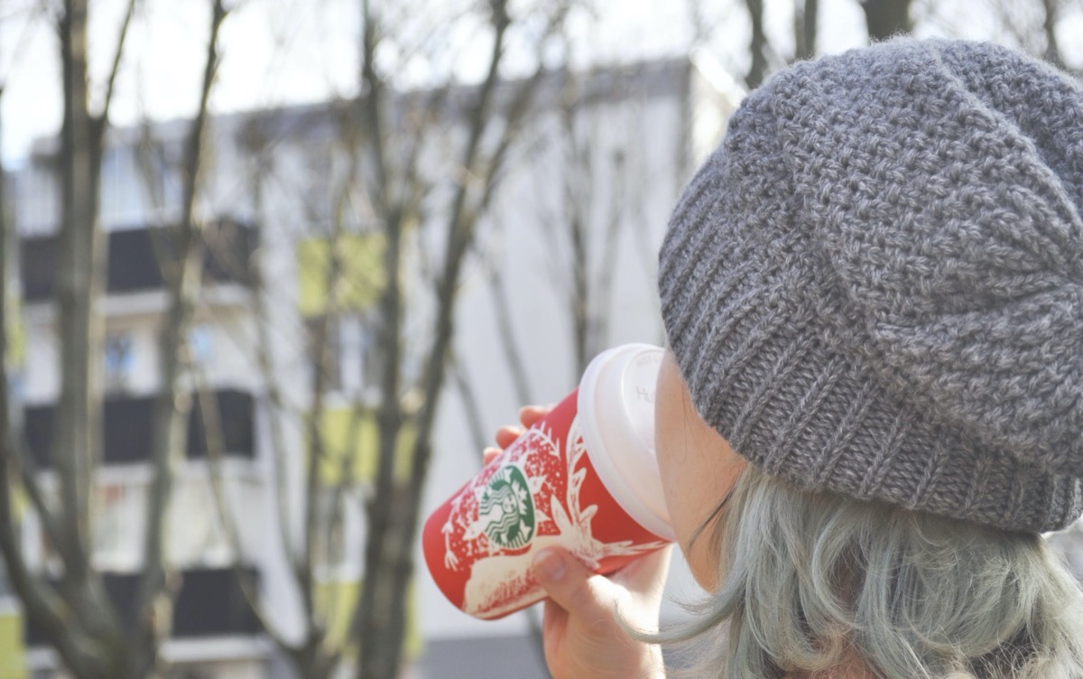 Woman drinking coffee.