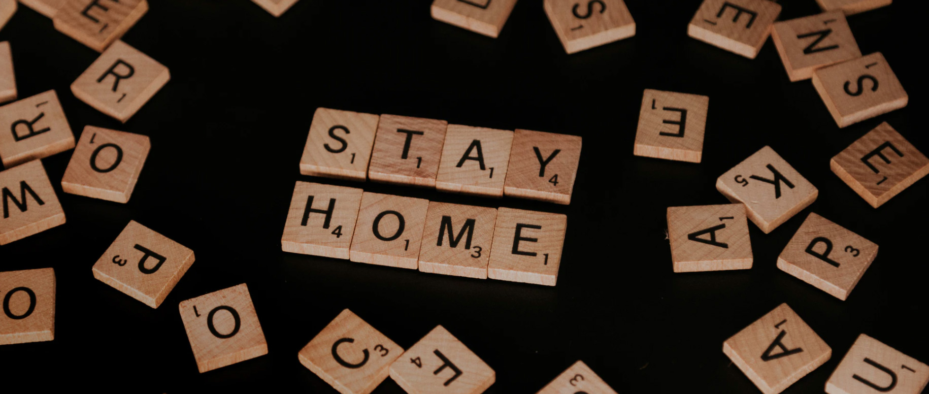 Stay home written out in tiles Unsplash - Priscilla Du Preez