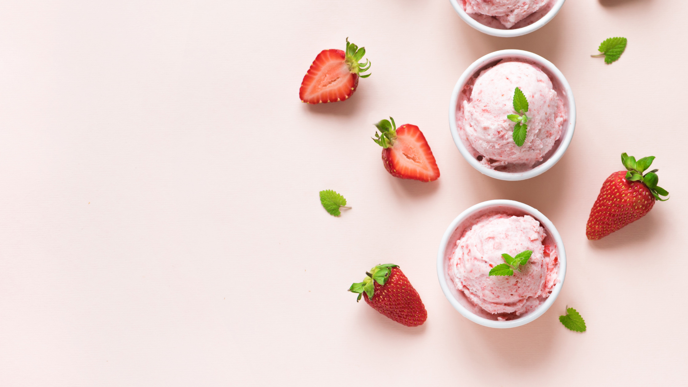 Strawberries and ice cream in a bowl Image - Canva