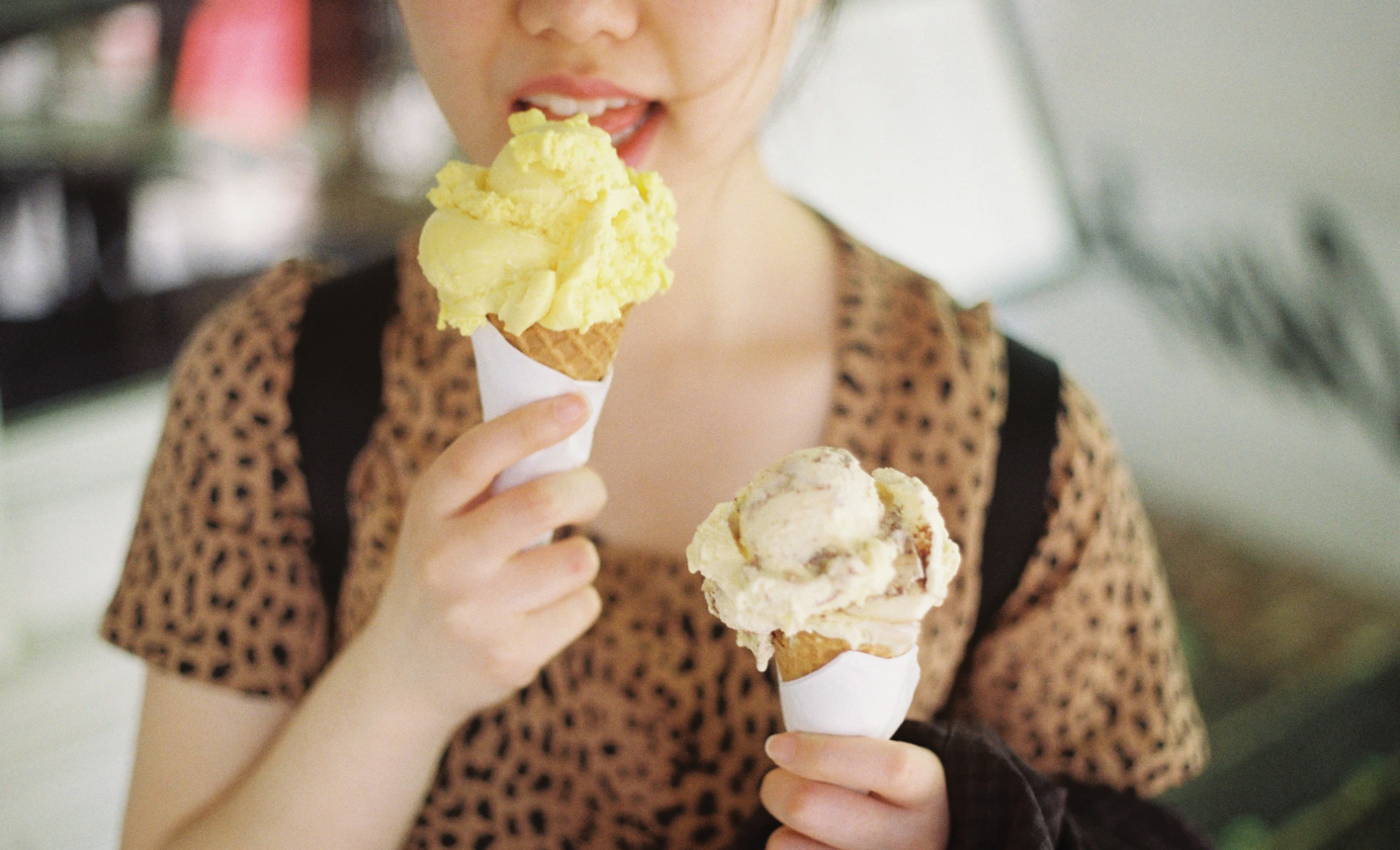 Girl eating two ice creams - Unsplash-Dylan Lu