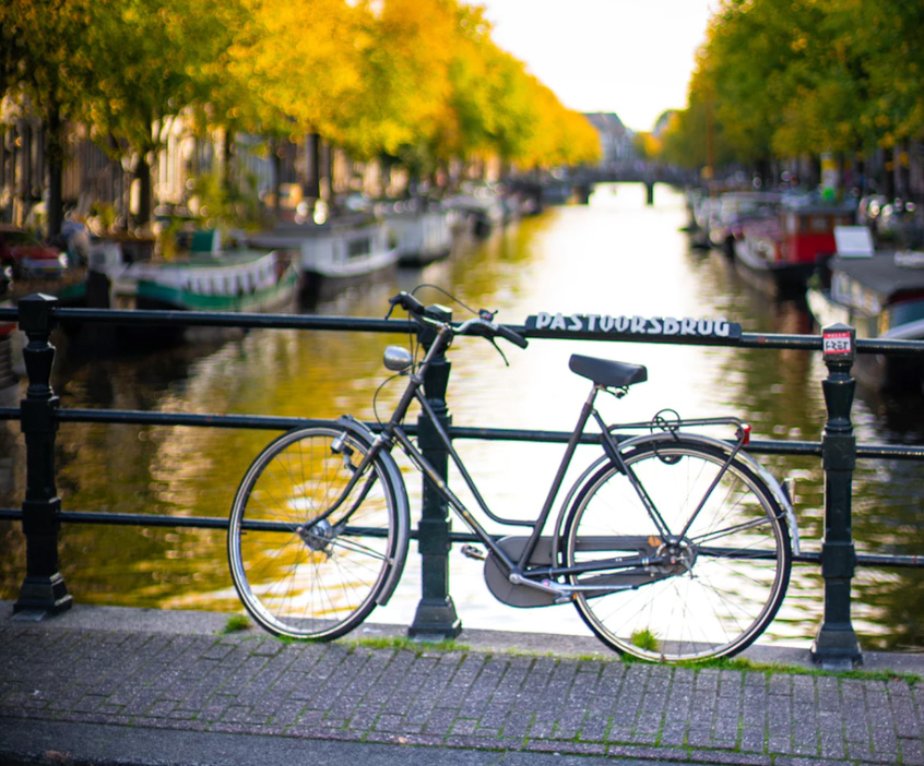 A bike against a canal. 