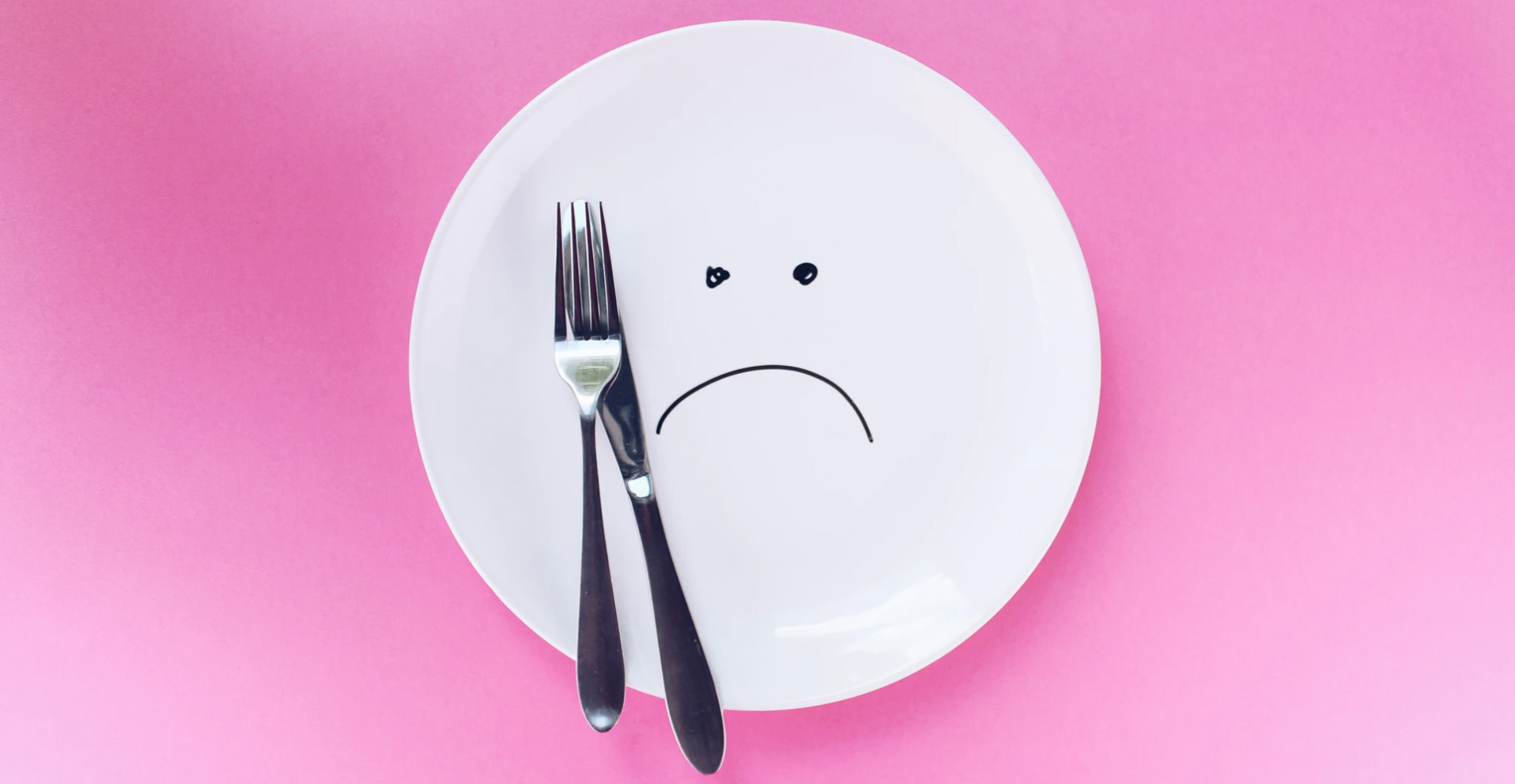 A plate with a fork and knife. 