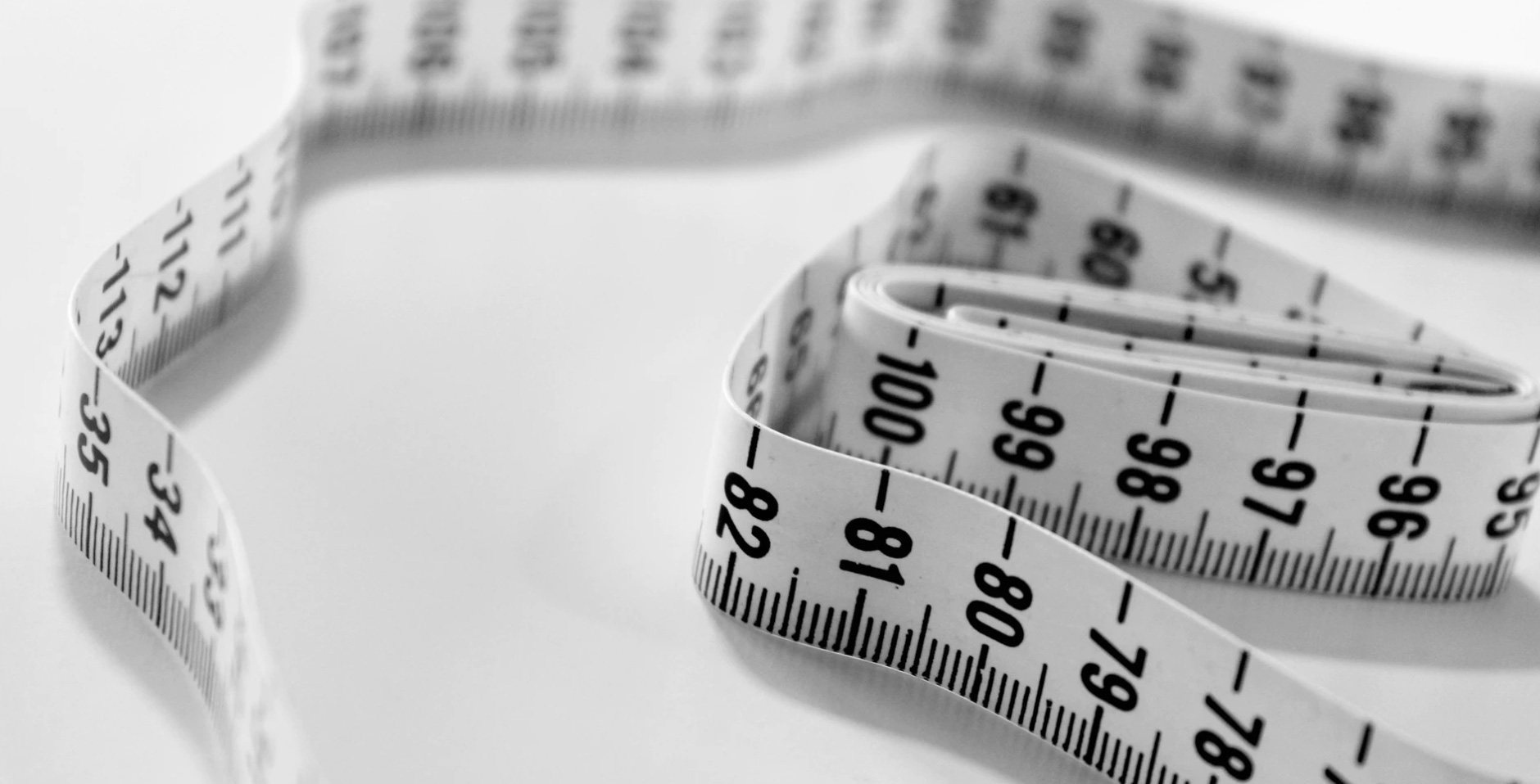 A measuring tape laying on a table. 
