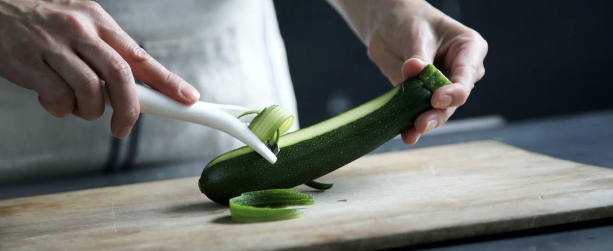 Woman cutting zucchini 